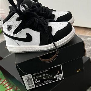 Jordan Kids Black and White High-Top Sneakers
